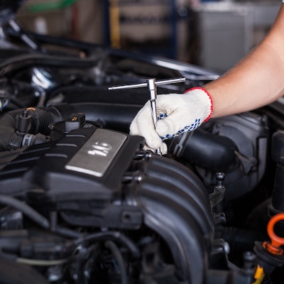 Hands of car mechanic, automotive industry